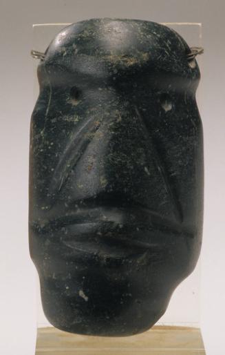 Stylized pendant in the form of a head