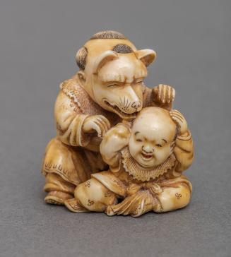 Netsuke: Two Boys Playing with a Fox Mask