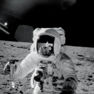 Apollo 12: Alan Bean Holding a Vacuum-Sealed Lunar Soil Sample Container