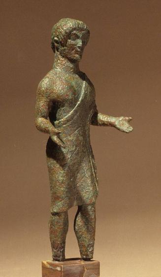 Votive figurine of male youth in short mantle