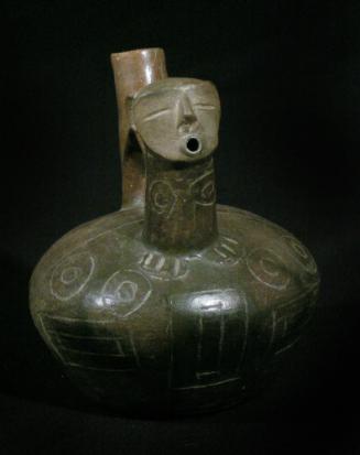 Blackware stirrup spout vessel with incised design