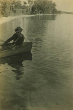 Man in Boat on Lake