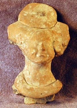 Female head with one-disk headdress and collar