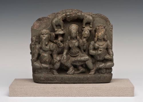 Goddess Gajalakshmi (center) with Kubera (God of Wealth) and Ganesha (God of Auspicious Beginnings)