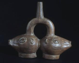 Stirrup spout double headed effigy vessel