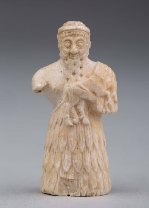 Votive statue of a man holding an animal