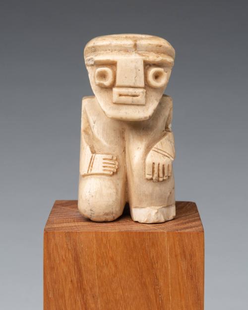 Kneeling figure