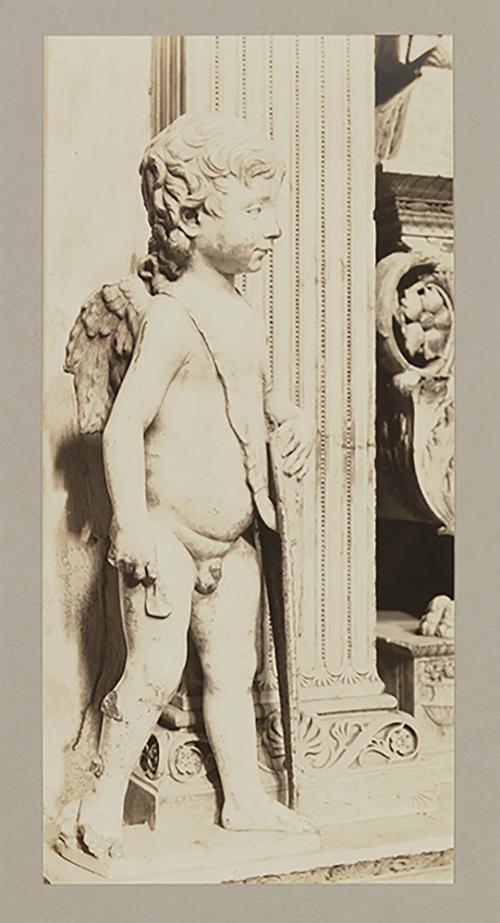 Putto at head of bier; Whole, facing four fifths right
