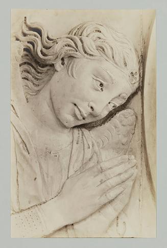 Adoring angel, relief, above head of bier; Head