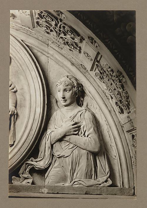 Adoring angel, relief, above foot of bier