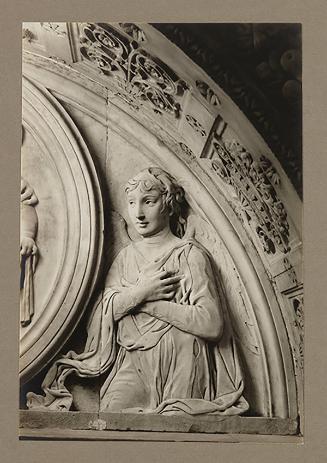 Adoring angel, relief, above foot of bier