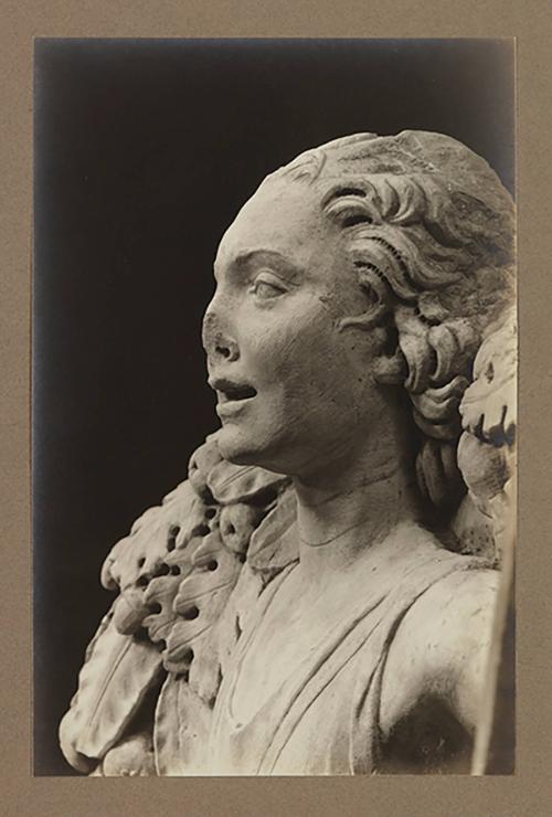 Youth bearing garland above head of bier; Head, almost in profile to the left