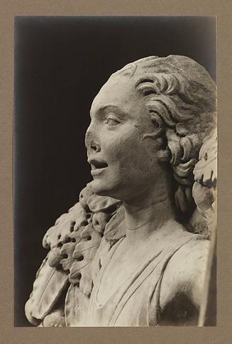 Youth bearing garland above head of bier; Head, almost in profile to the left