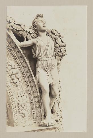 Youth bearing garland above foot of bier, facing one half right