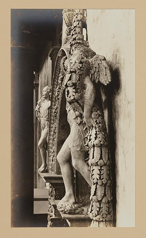 Youth bearing garland above foot of bier, nearly in profile to the left
