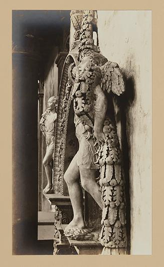 Youth bearing garland above foot of bier, nearly in profile to the left