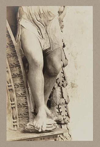 Youth bearing garland above foot of bier; Legs, from the waist down