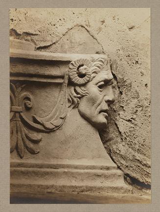 Head, in profile to the left, from base of finial
