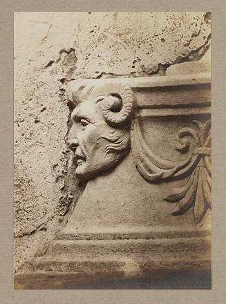 Head, in profile to the right, from base of finial
