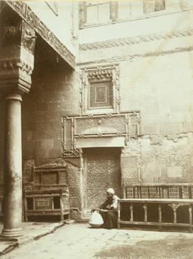 Untitled (Man Sitting in Carved Doorway)