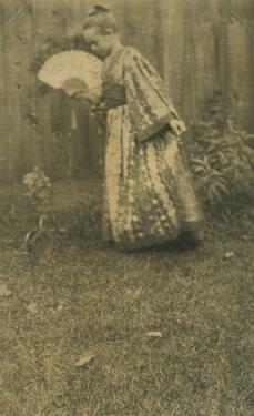 Young Girl in Kimono Waving Fan