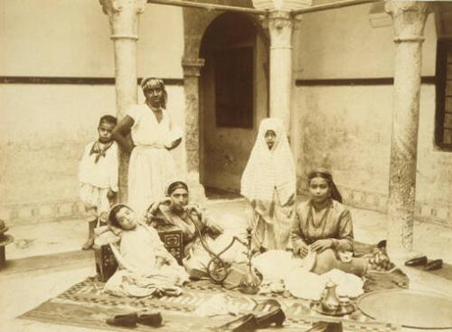 Women Sitting, One Smoking, Algeria