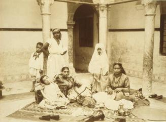Women Sitting, One Smoking, Algeria