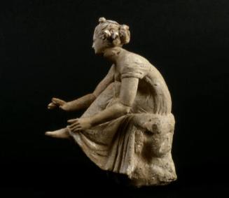 Draped seated female figure