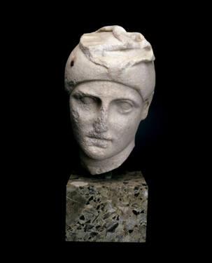Head of a male youth wearing a Phrygian cap